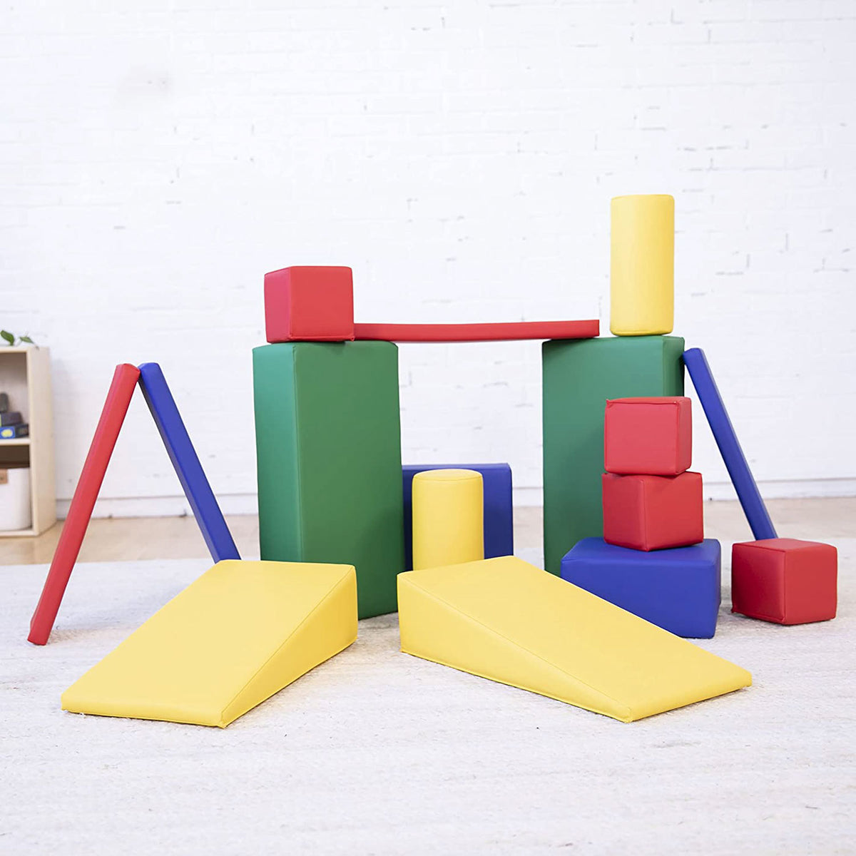 Blue foam building blocks allow kids to create structures and interact with  other children at the I…
